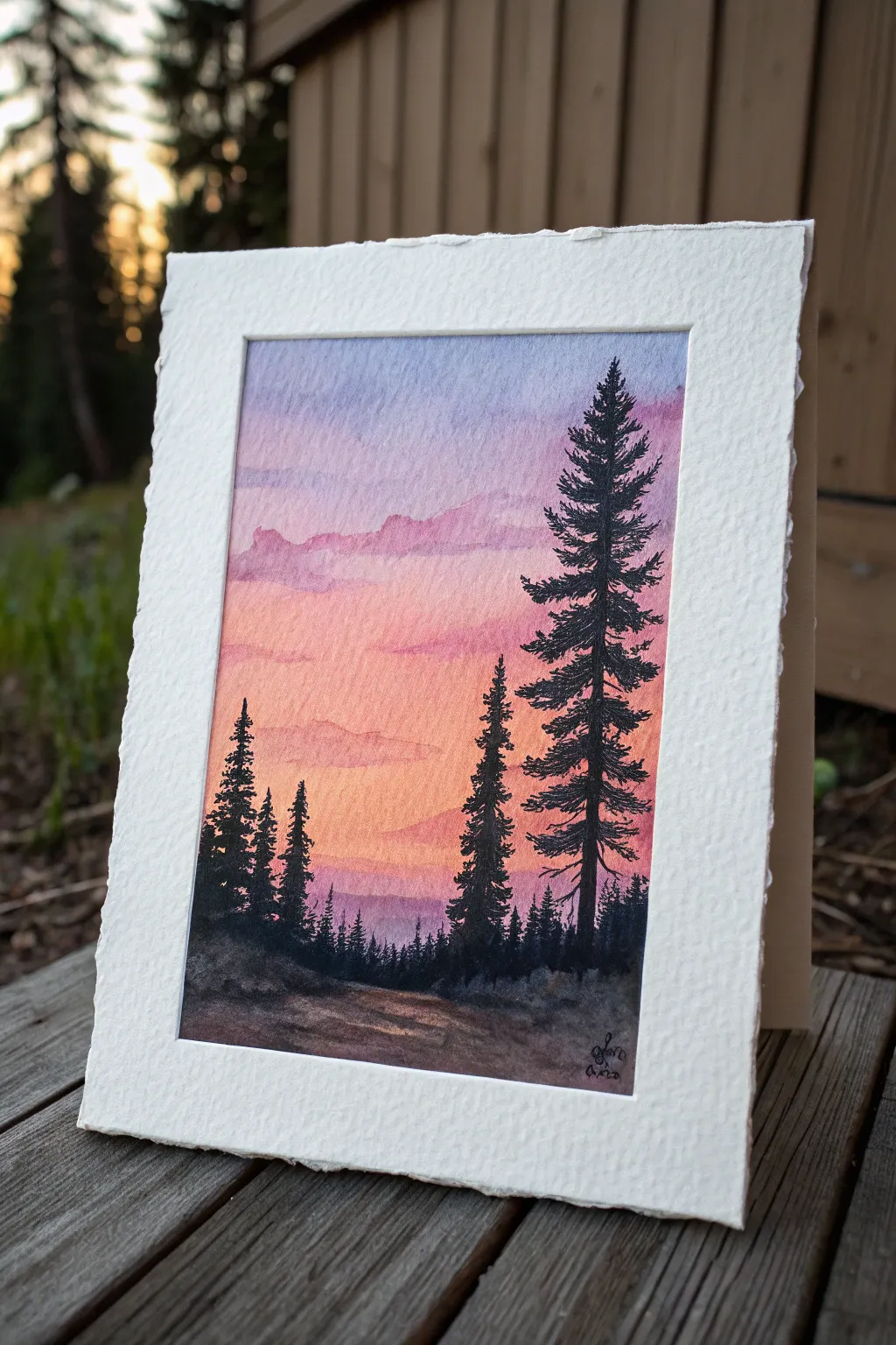 Minimal pine silhouettes on a warm-to-cool ombre sky, a serene nature painting idea.