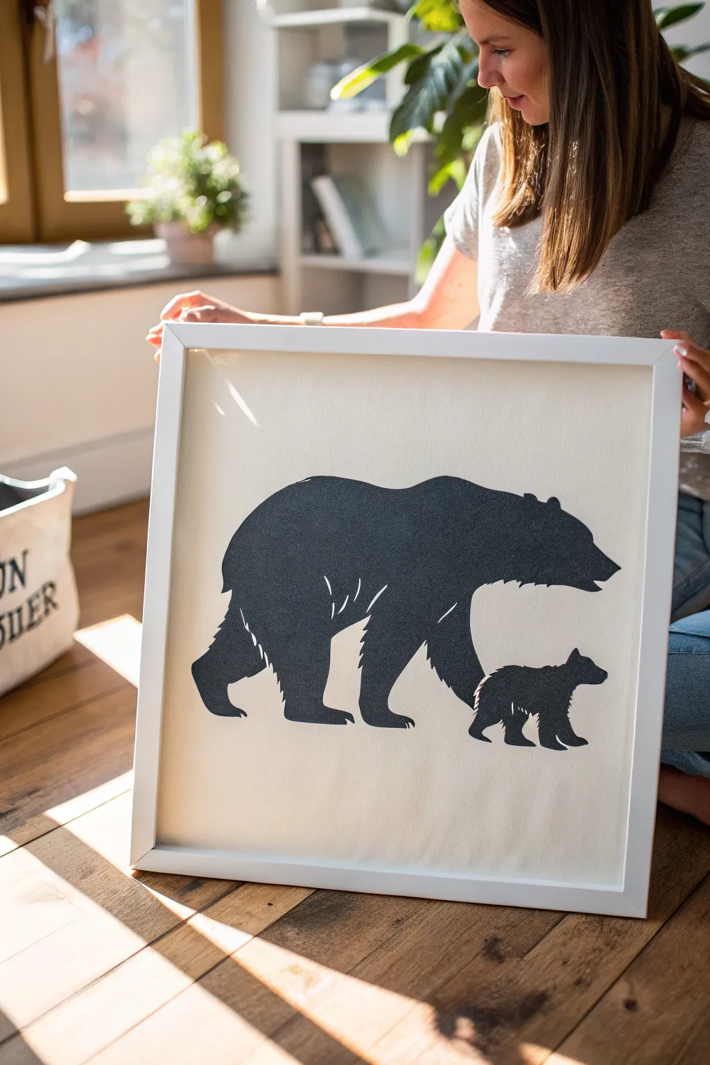 Minimal bear silhouette with a hidden baby revealed through bold negative space, clean and striking