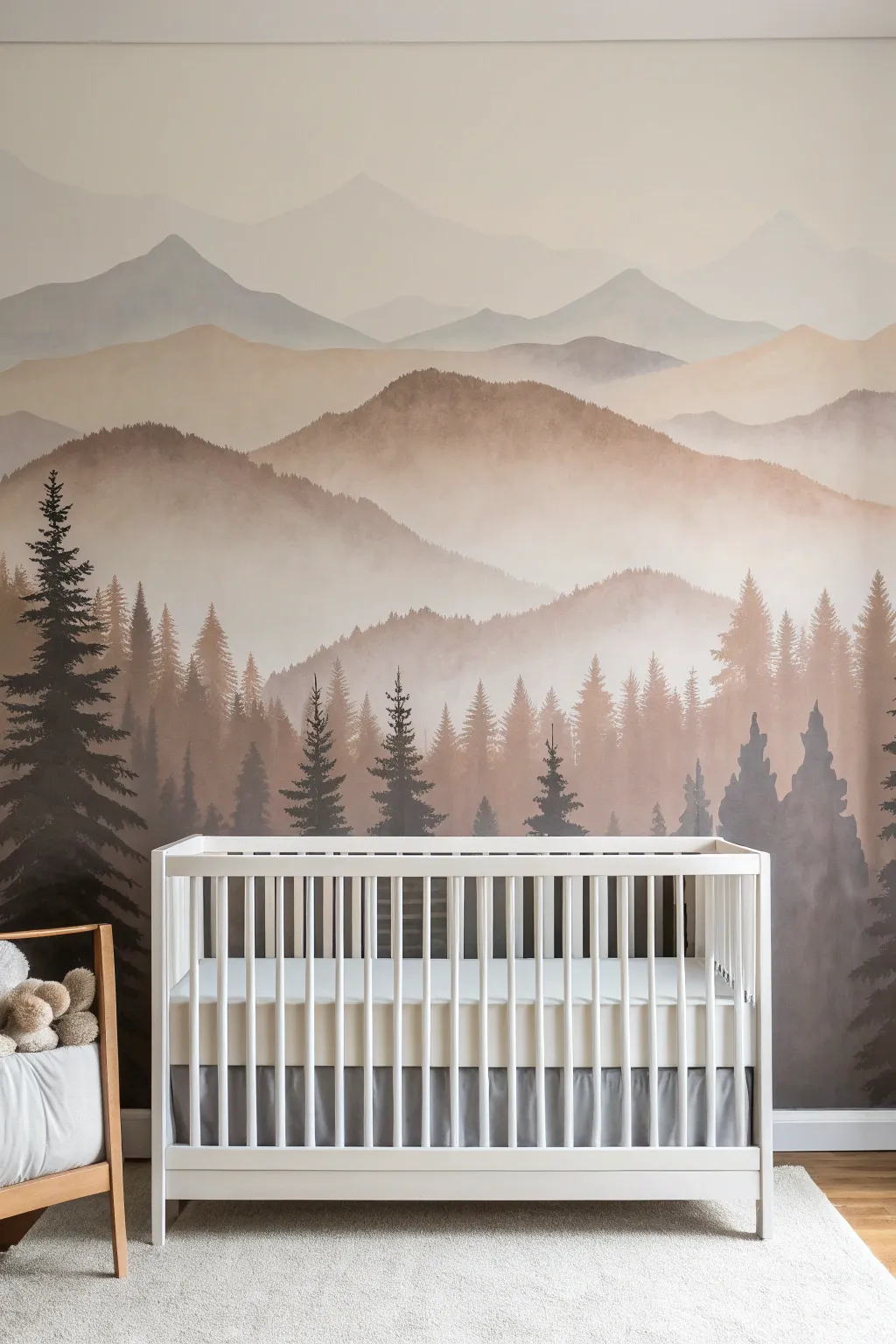 Soft neutral misty mountain mural creates a calm Scandinavian nursery feature wall with boho warmth