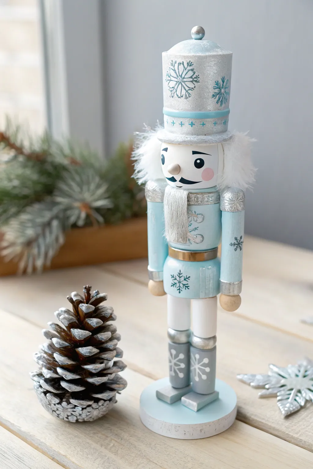 bring a serene winter vibe to your holiday decor with this DIY icy blue and silver nutcracker