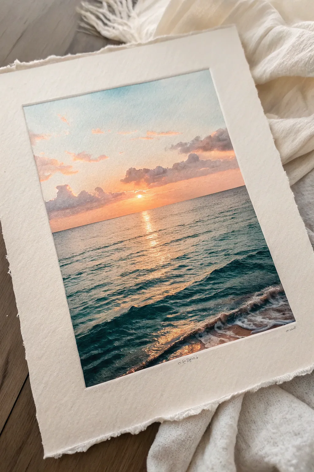 Warm sunset bands shimmer on calm ocean water, a minimalist glow-to-deep-teal contrast.