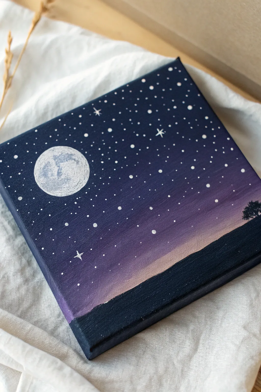 Easy paint and sip idea: minimalist starry night with dot stars and a glowing moon