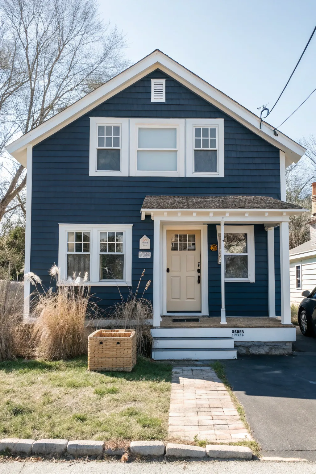 Bold navy siding and crisp white trim for a timeless, high-contrast painted house look