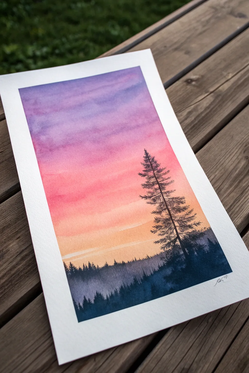 Sunset gradient wash with a crisp black treeline silhouette for an easy high-contrast paper painting