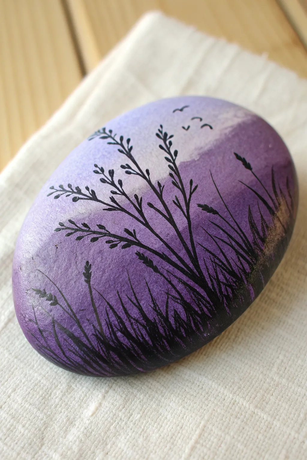 Purple ombre sunset rock with crisp black silhouettes, minimal and moody twilight vibes