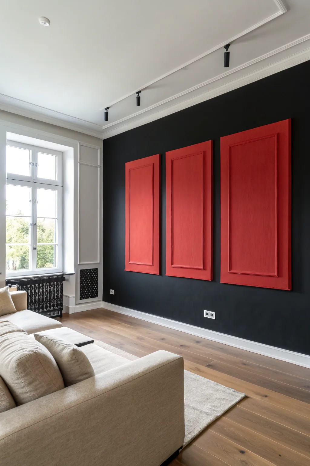 Matte black feature wall with bold red panels creates a modern art zone behind the sofa.