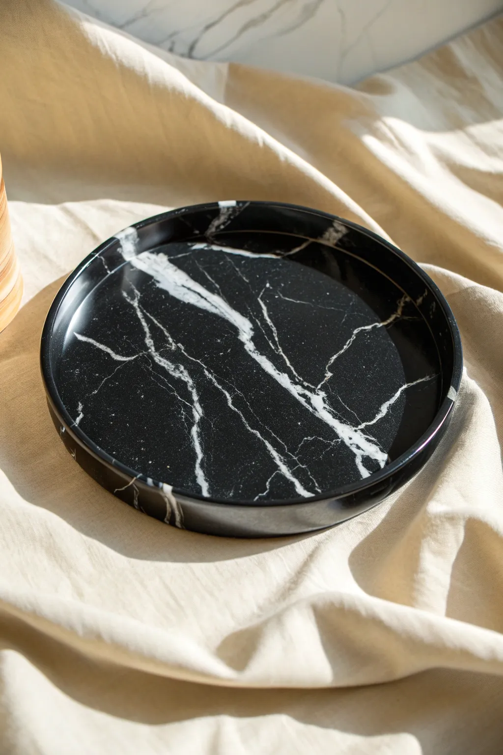 Classic resin contrast: inky black with crisp white swirls and glossy studio reflections.