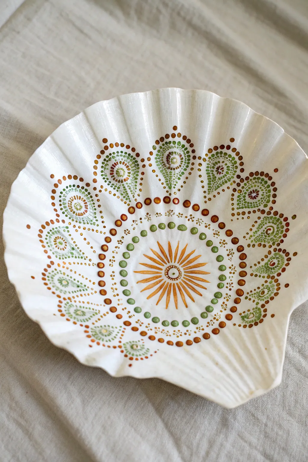 Turn beach treasures into boho art with this calming seashell dot mandala design.