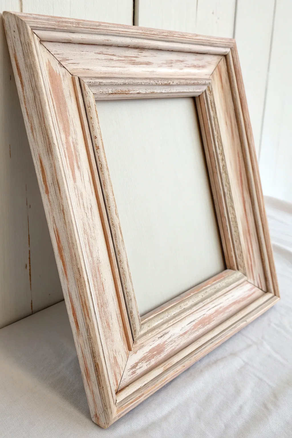 Soft chalk paint and sanded edges reveal warm wood grain for a simple vintage frame look