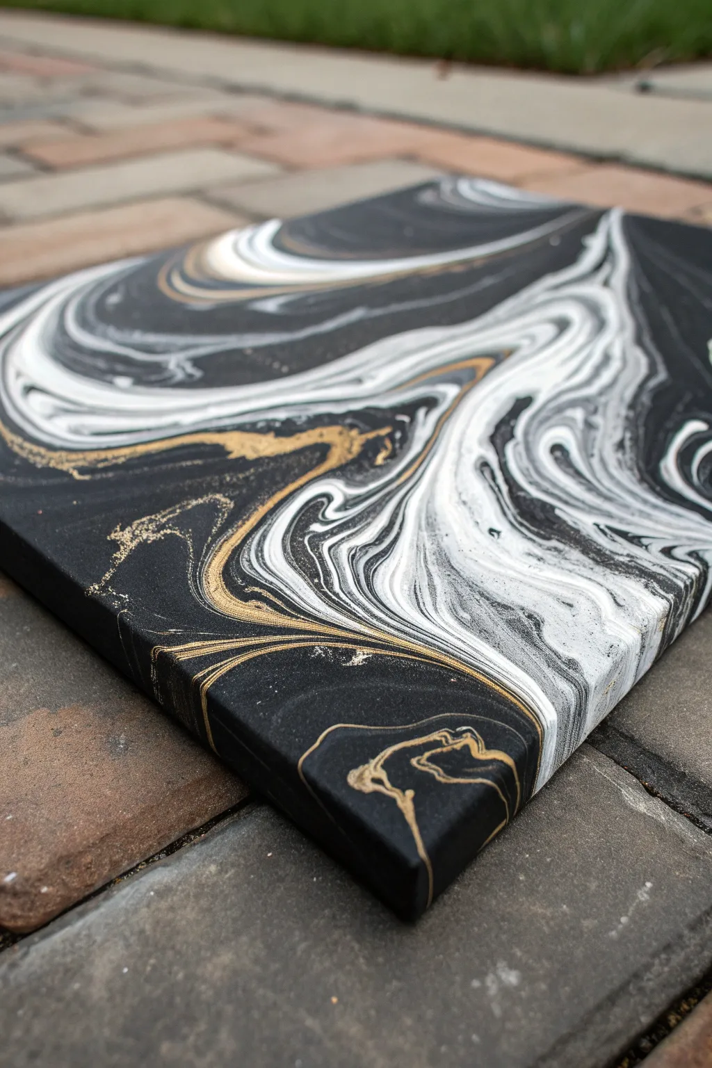 Dramatic black canvas pour with white and metallic swirls, glossy cells, minimalist mood