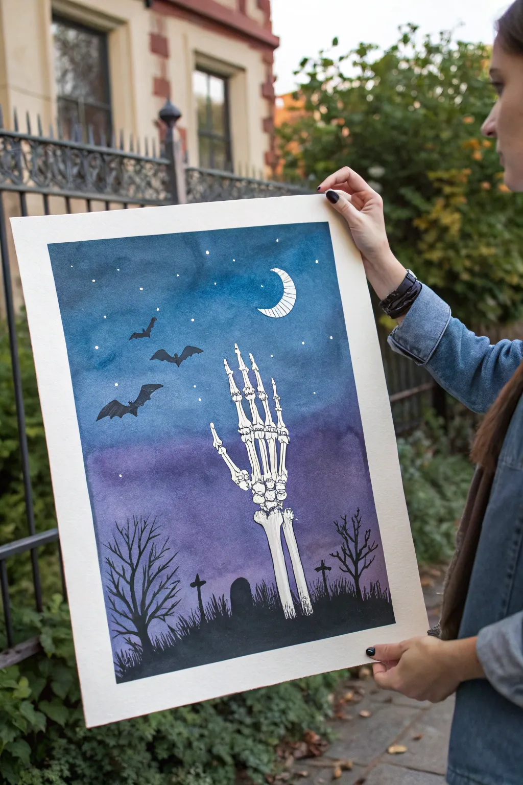 Paint a chic Halloween scene: negative-space bone hand on a plum-to-midnight gradient sky.