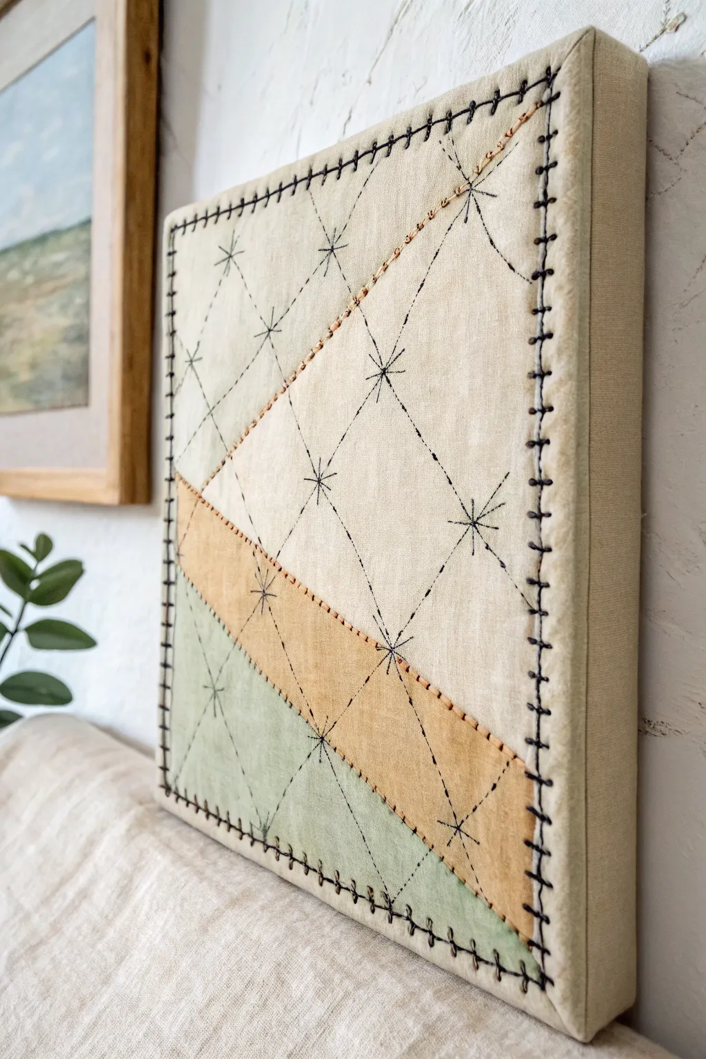 Minimal stitched canvas: painted layers with tactile thread lines for mixed-media inspiration