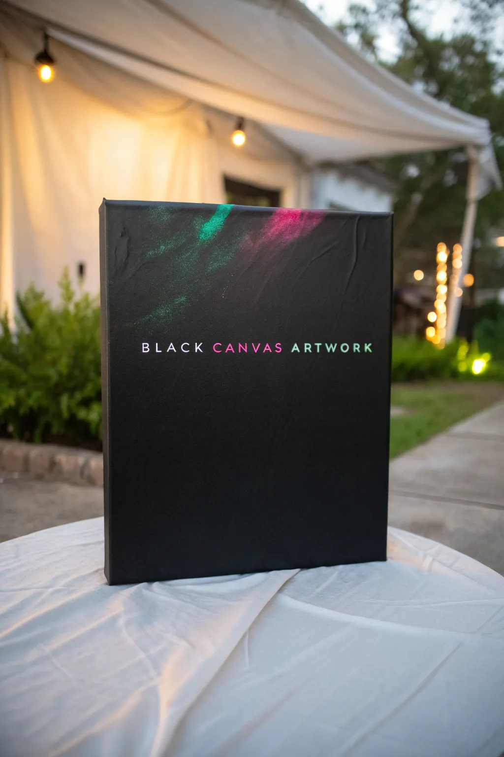 Minimal black canvas with neon glaze revealing a secret message, glowing softly in the dark