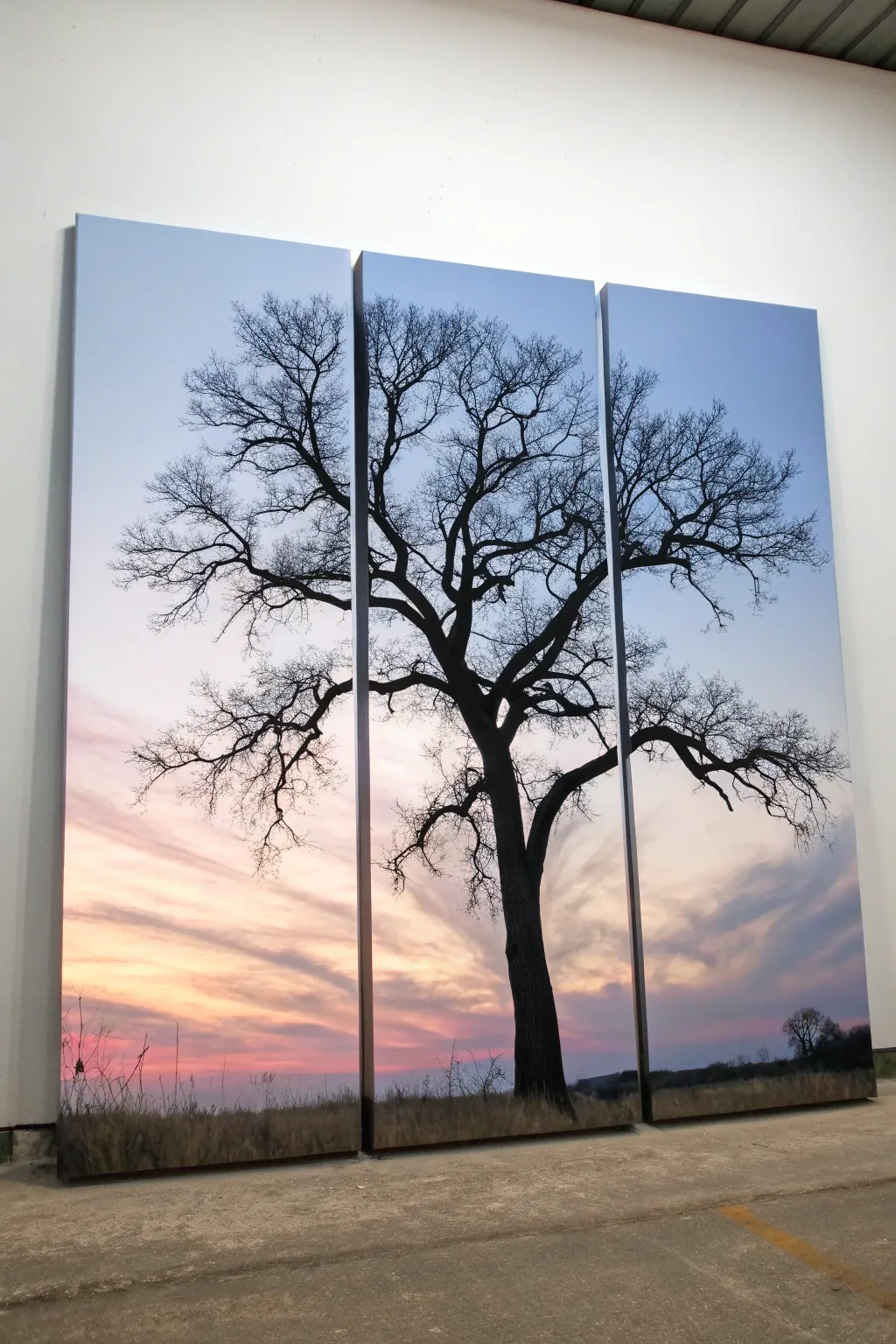 Beginner-friendly triptych: a bold black tree silhouette spanning three canvases over a blended sky