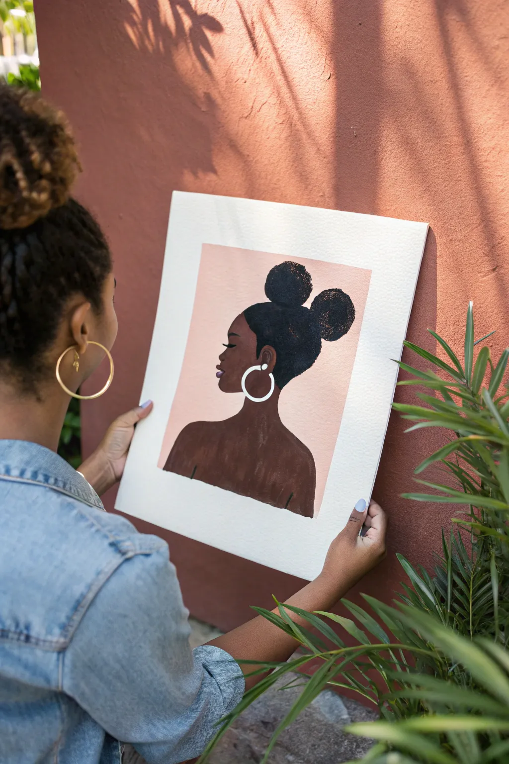 Easy black girl painting idea: two puff buns and hoop earrings in a minimalist boho look