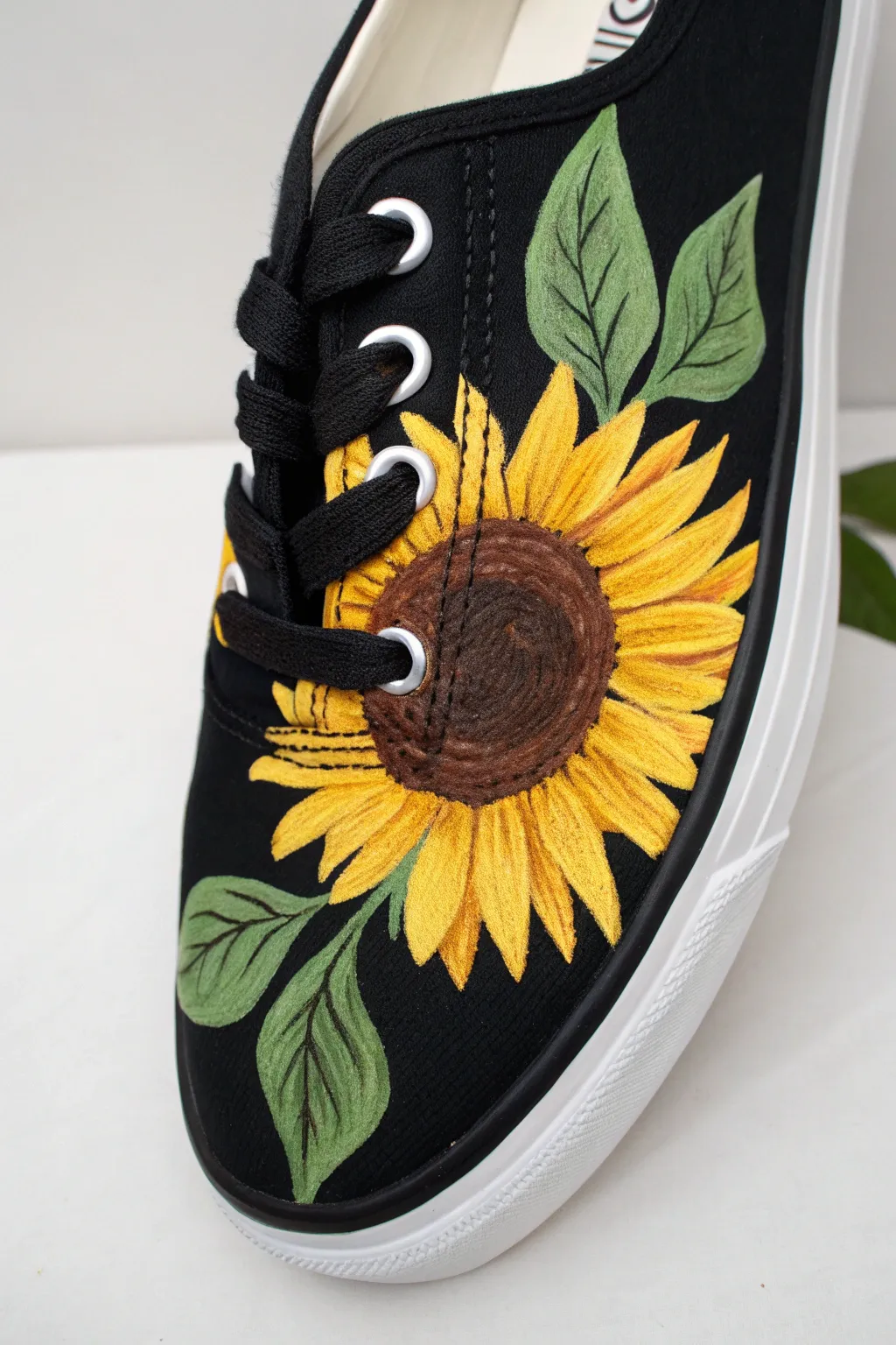Sunflower side panel on a black sneaker, shown half-painted for a clean, DIY-friendly pop.