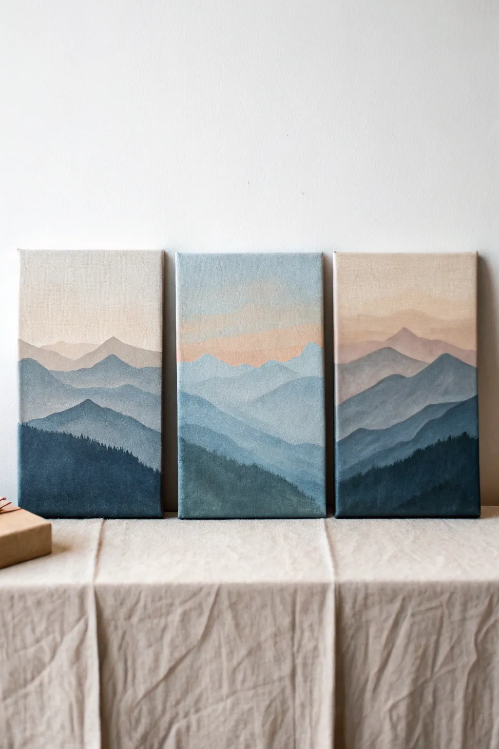 Mini mountain layers on slim canvas boards in soft neutrals for calm, minimalist wall art