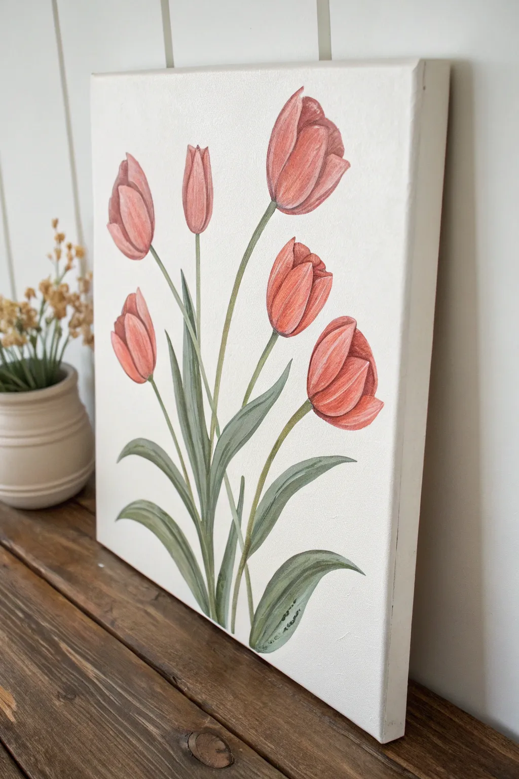 Simple one-stroke tulips in warm red-to-coral blends on a clean minimalist canvas.