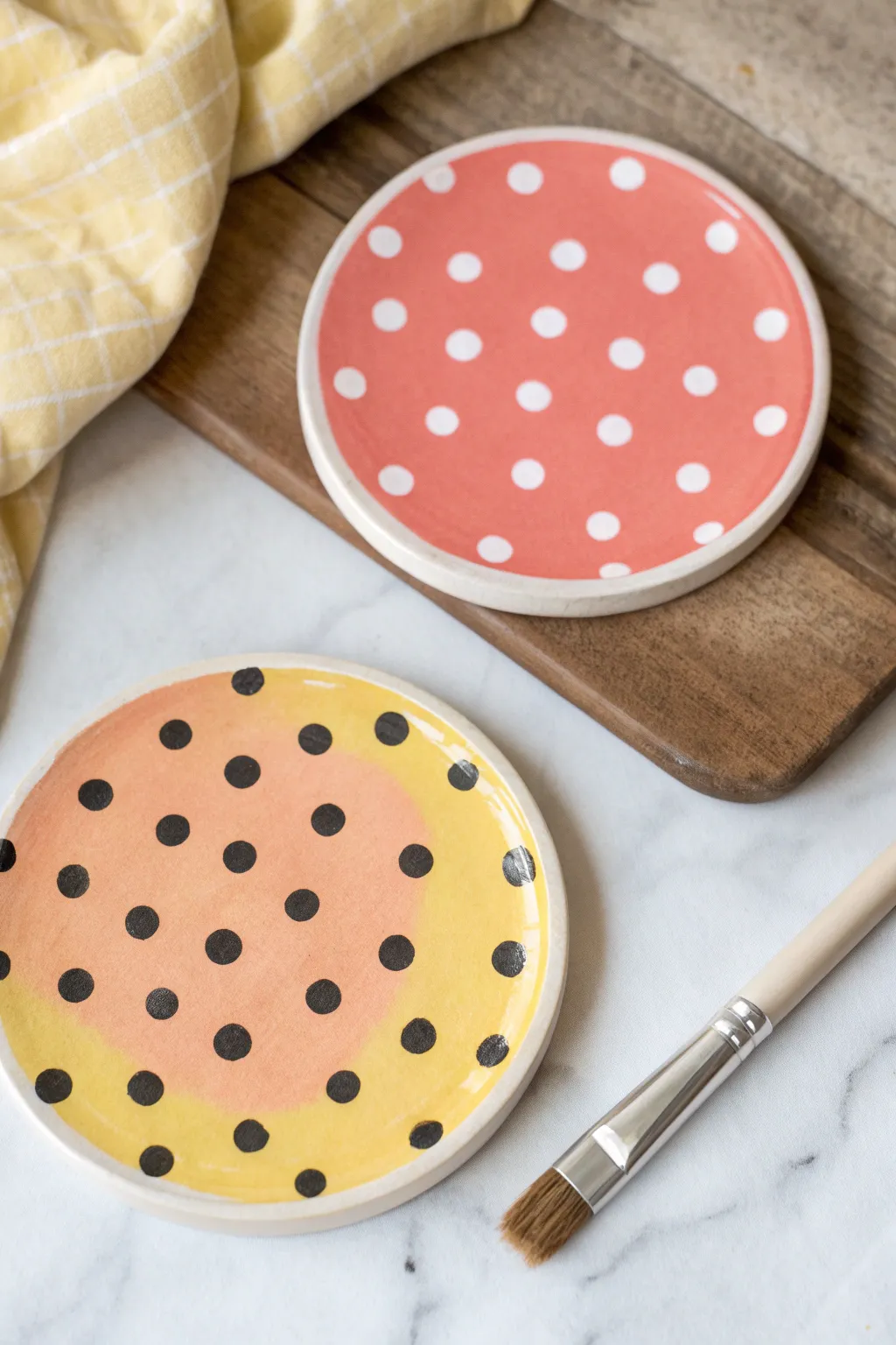 Bright polka dot ceramic coasters with a clean Nordic-boho vibe, ready for easy painting.