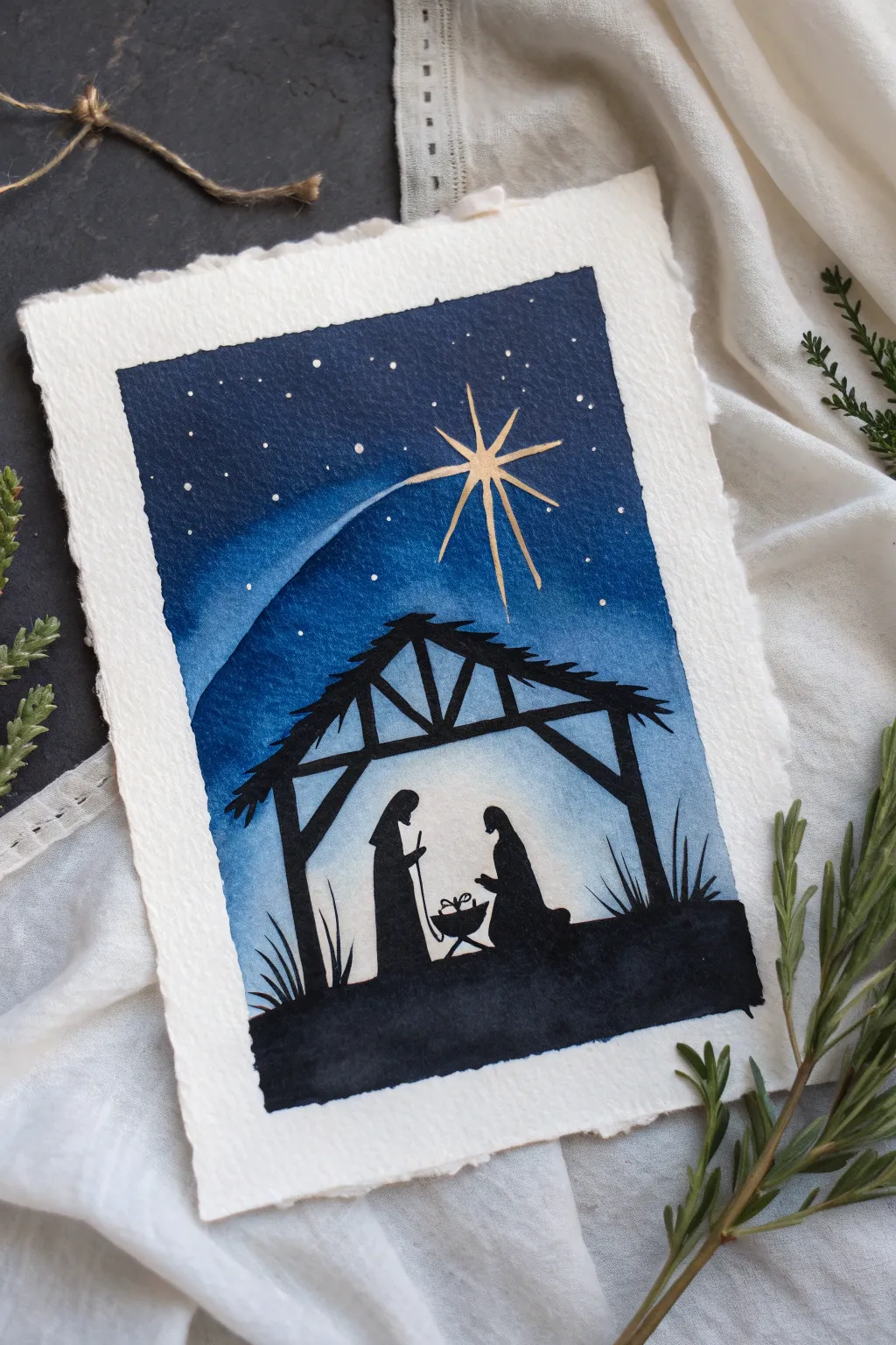 Minimal nativity silhouette under a glowing star, painted in deep indigo for calm Christmas nights.