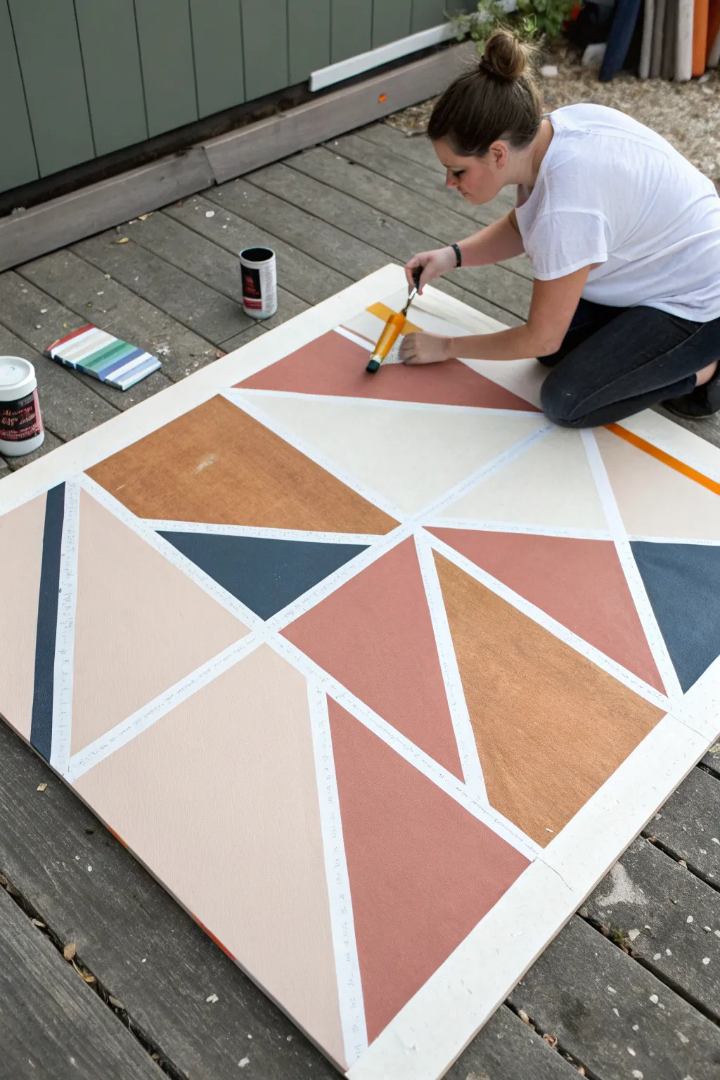 Hard edge tape polygons in progress, crisp modern geometry with soft Scandinavian boho tones