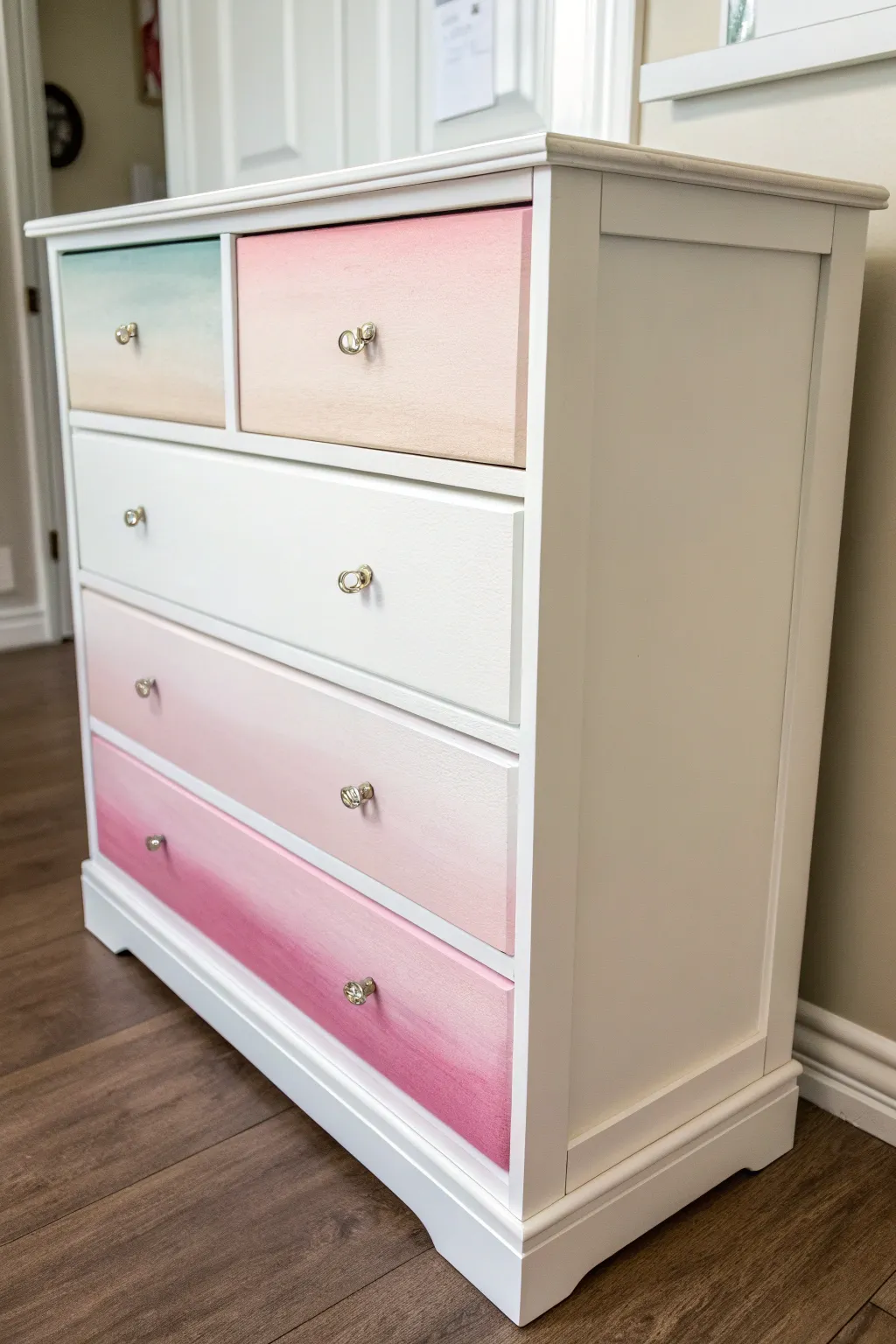 Soft pastel ombré drawers fading to near-white for a dreamy, minimalist girl dresser makeover.