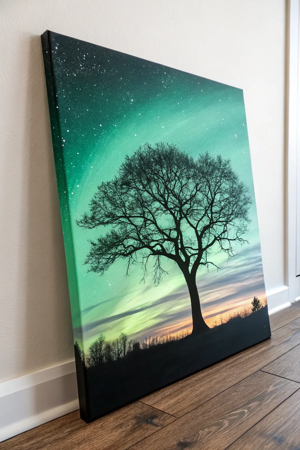 Minimal lone tree silhouette against a glowing green gradient sky for an easy, striking canvas idea