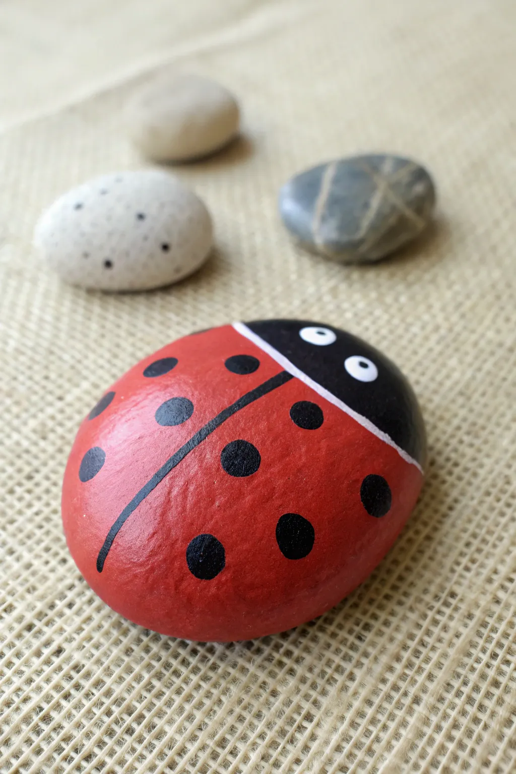 Easy ladybug dot rock DIY: simple red base, clean black dots, and soft minimalist styling