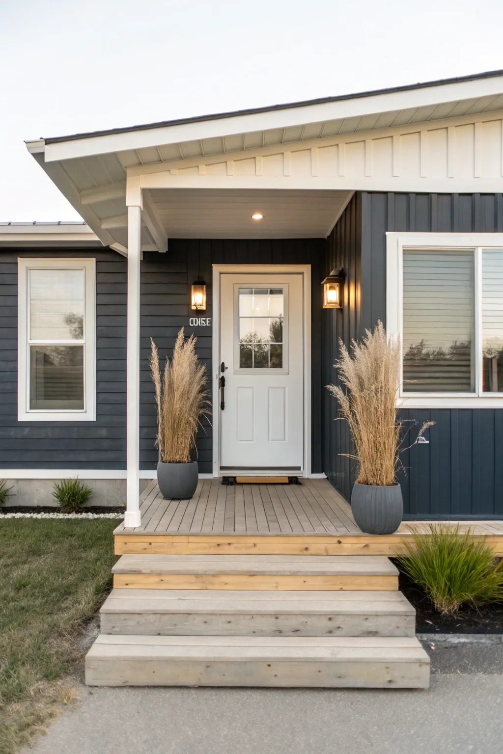 Modern charcoal mobile home with pale trim and a clean porch for bold, airy contrast