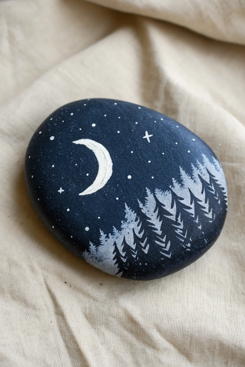 Moonlit night-sky rock with crescent moon, clustered stars, and a quiet forest silhouette