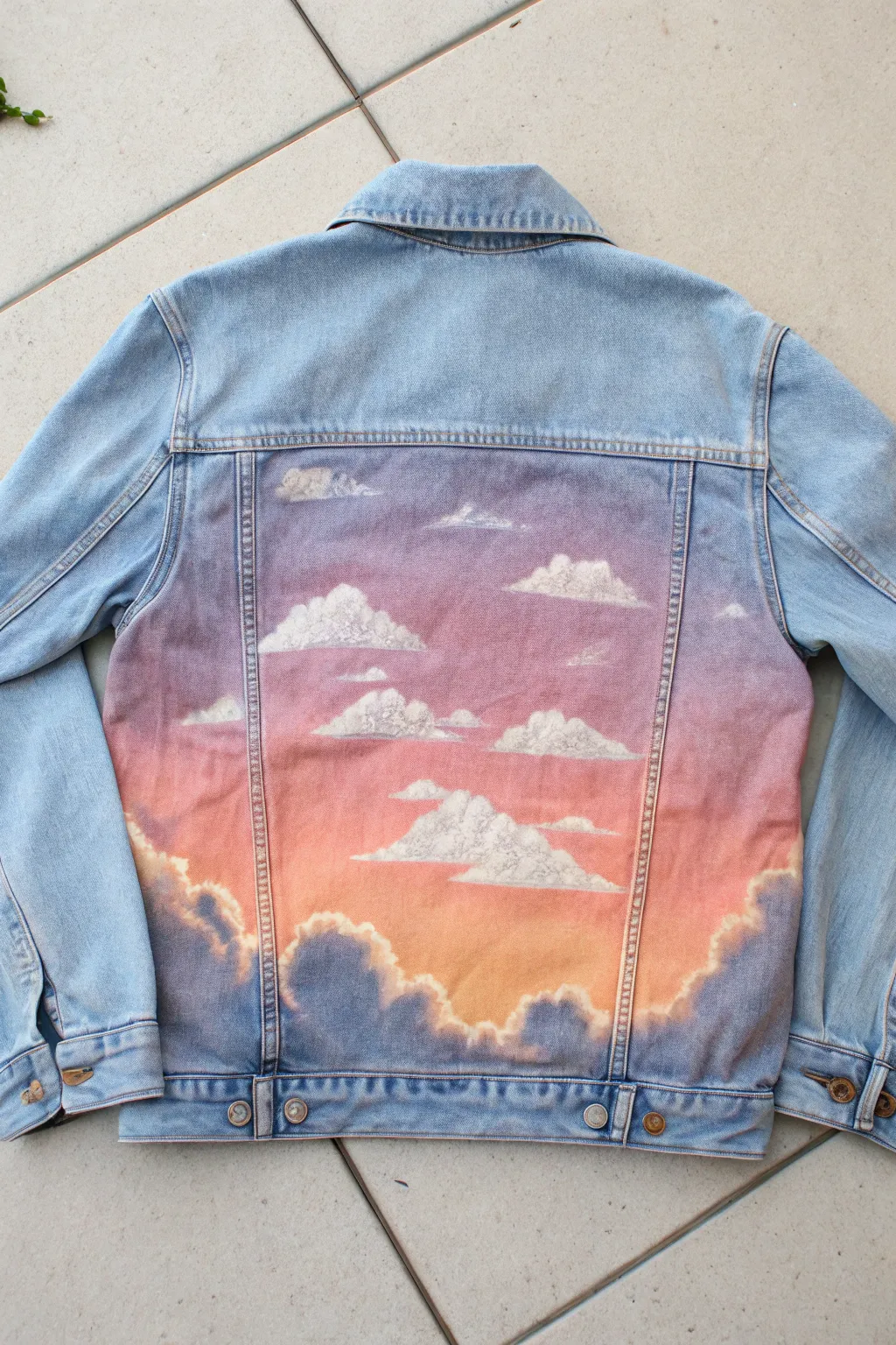 Dreamy sunset ombré on a denim back panel, soft clouds and cozy Scandinavian styling