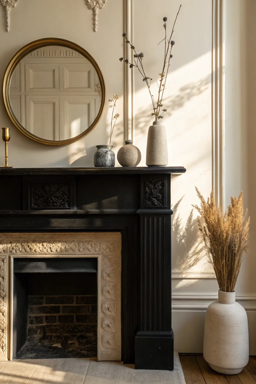 Matte black mantel styling for instant drama, softened with brass glow and sculptural boho accents