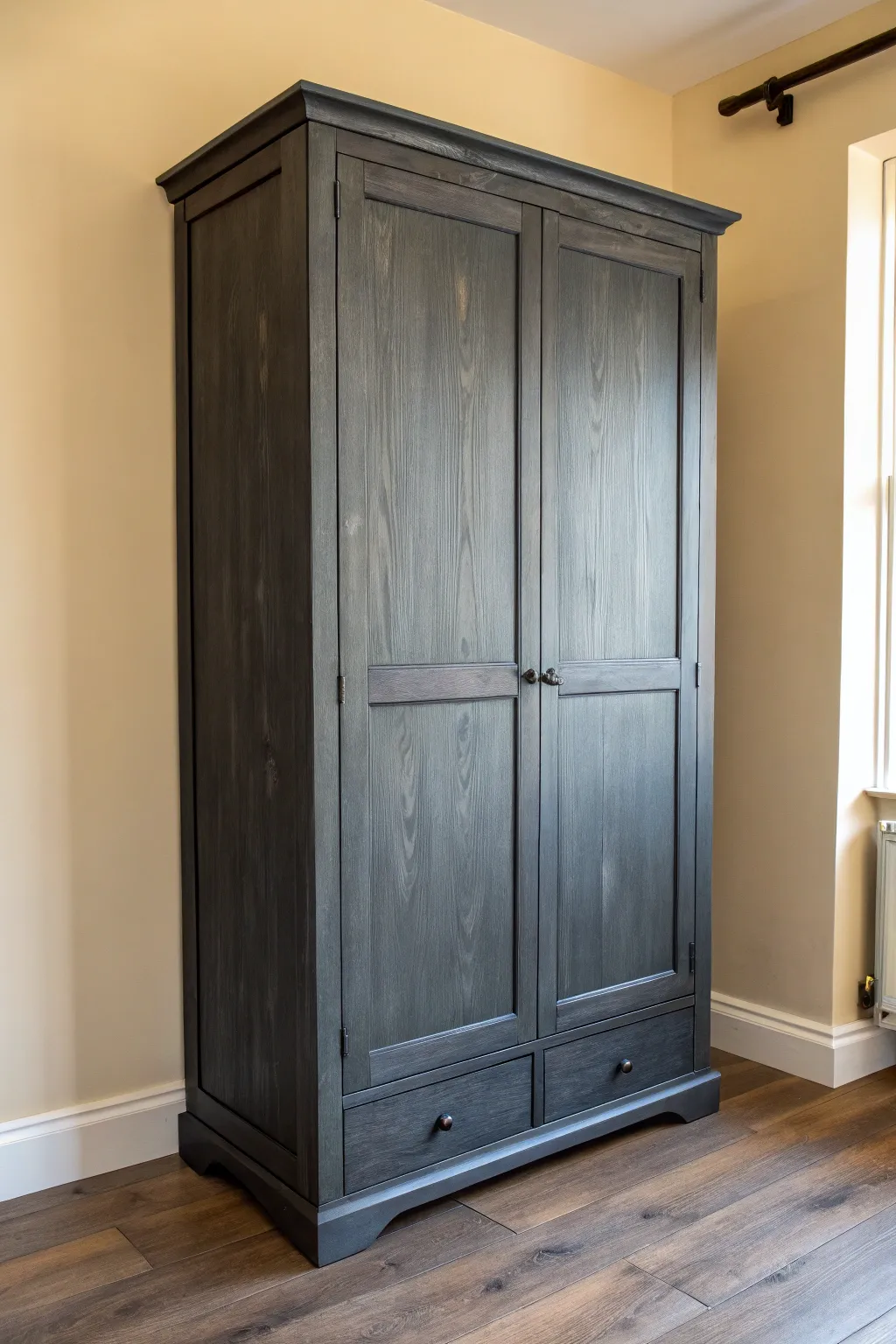 Moody charcoal wardrobe makeover that pops against pale walls and warm wood floors