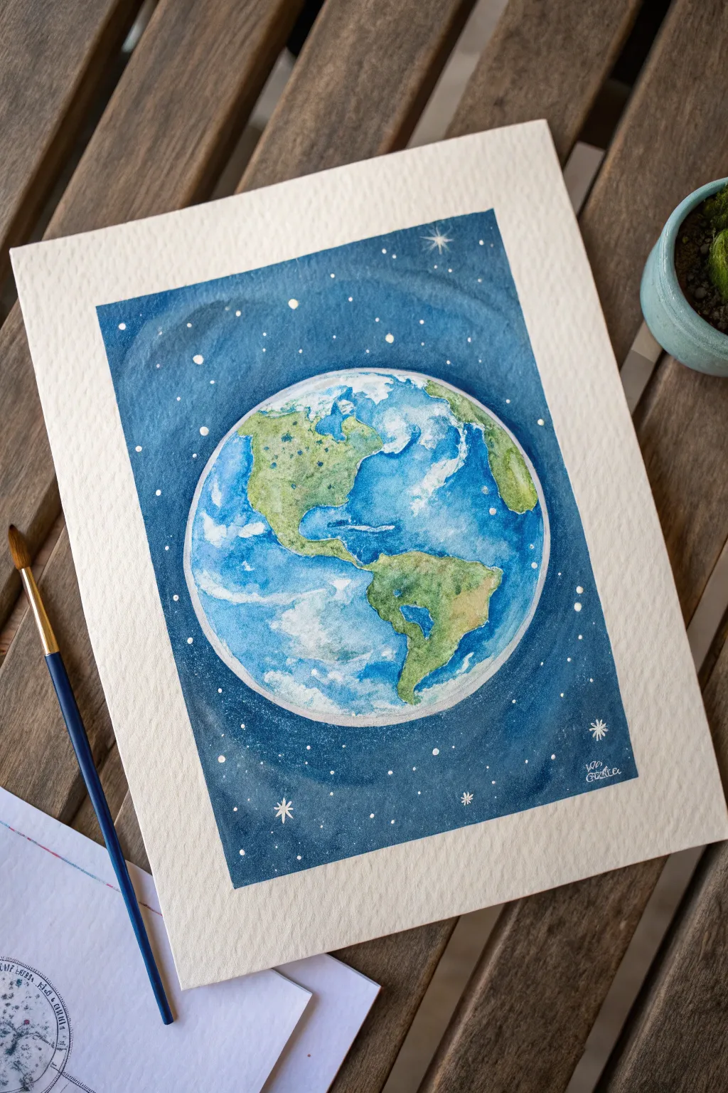 Glowing Earth with airy cloud swirls and a thin blue rim, floating in calm, star-speckled space.