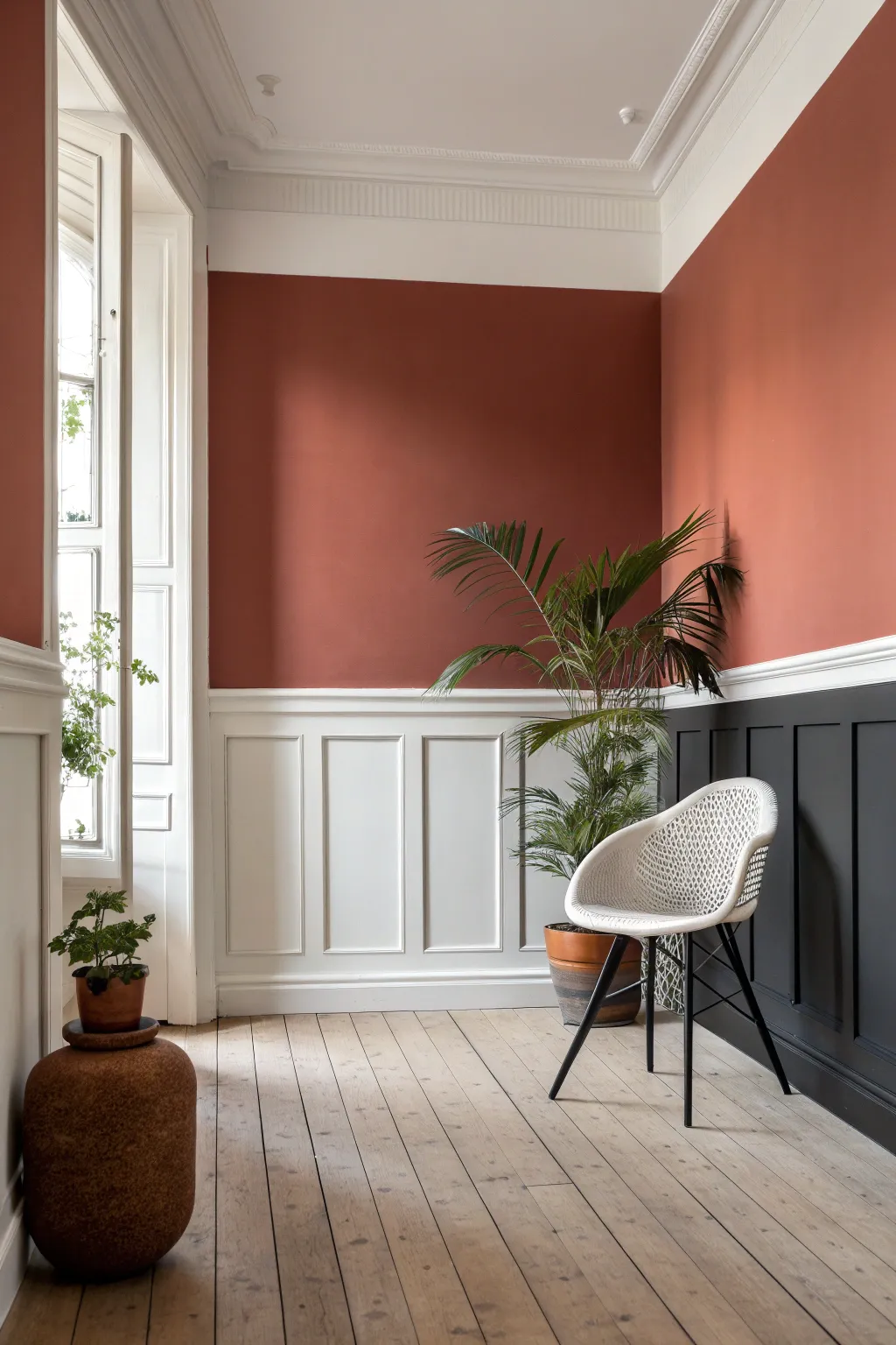 Balanced red and black two-tone wall split by a crisp chair rail for a modern classic finish