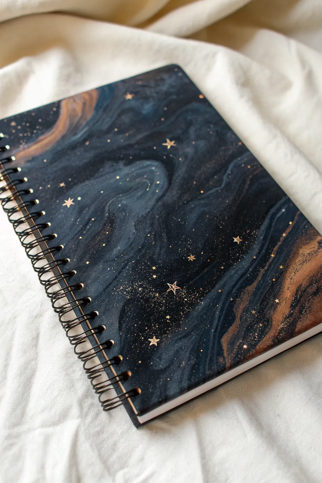 Create a mica powder galaxy resin notebook cover with shimmering flecks and starry splatter.