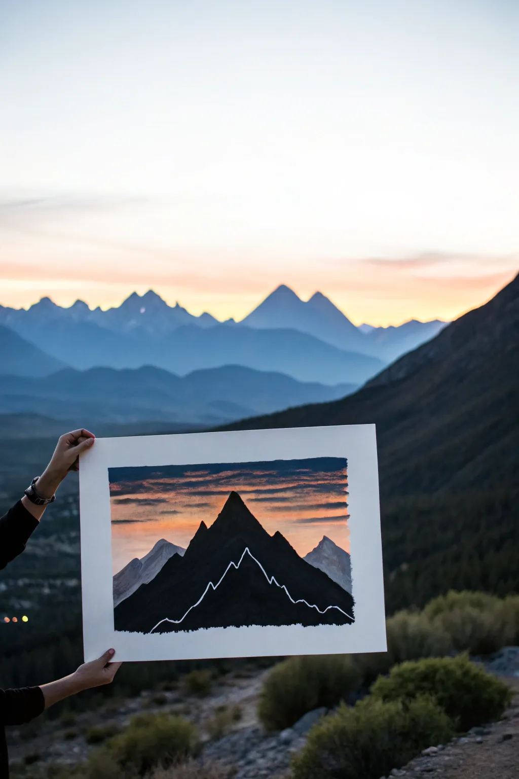 Layered black mountain silhouettes with a peach-to-indigo sky glow, simple and calming to paint.