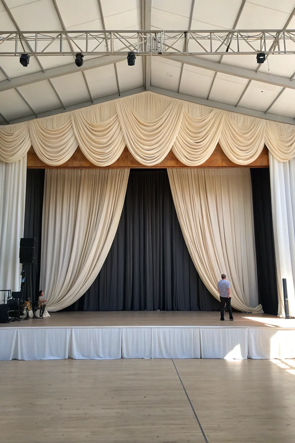 Classic curtain wall backdrop with soft swags, linen texture, minimalist stage elegance