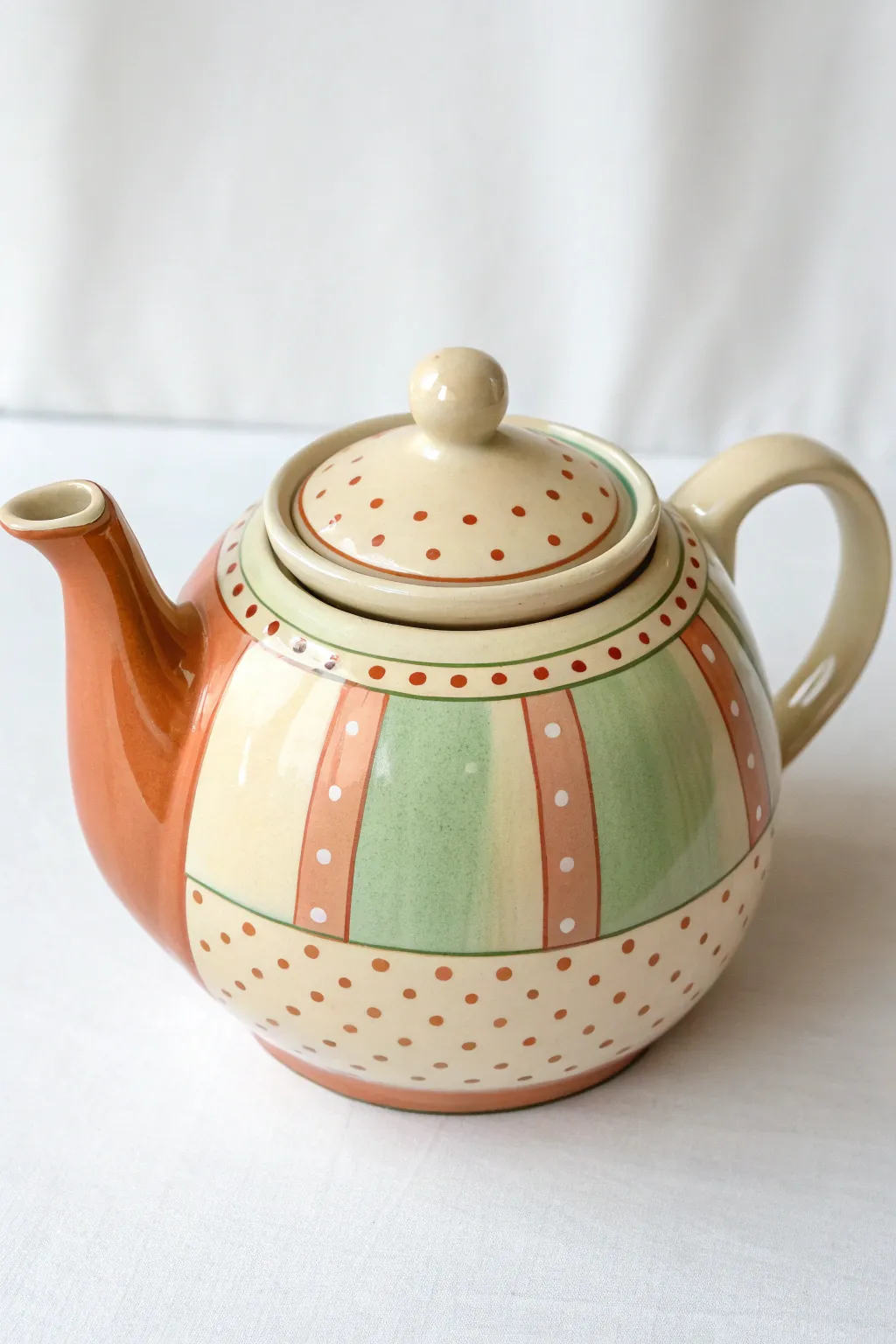 Beginner friendly teapot design: clean painted bands and cheerful polka dots in soft boho hues.