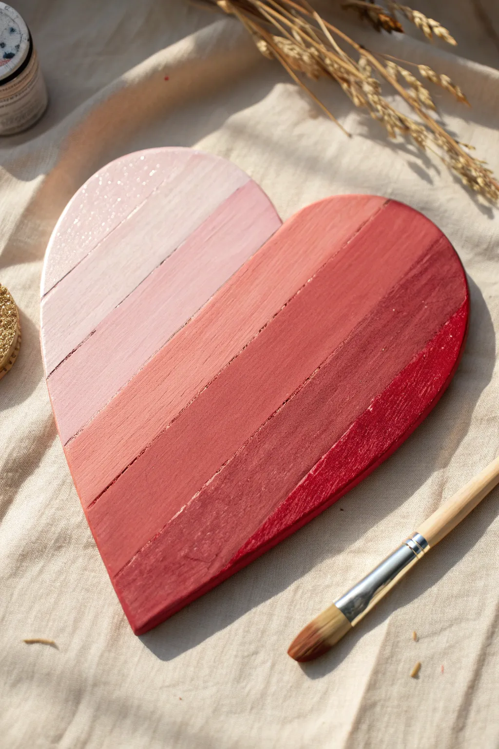Soft pink-to-red ombre wooden heart with brush and sponge cues for effortless, dramatic depth