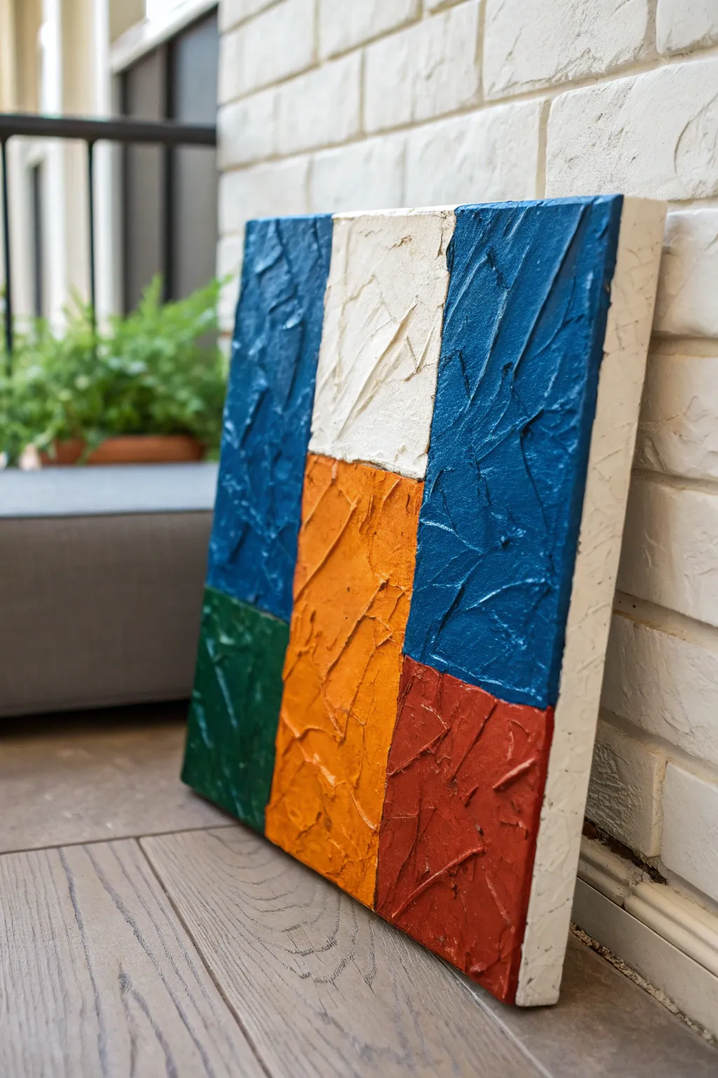 Palette knife texture blocks with bold color and raised ridges catching soft side light.