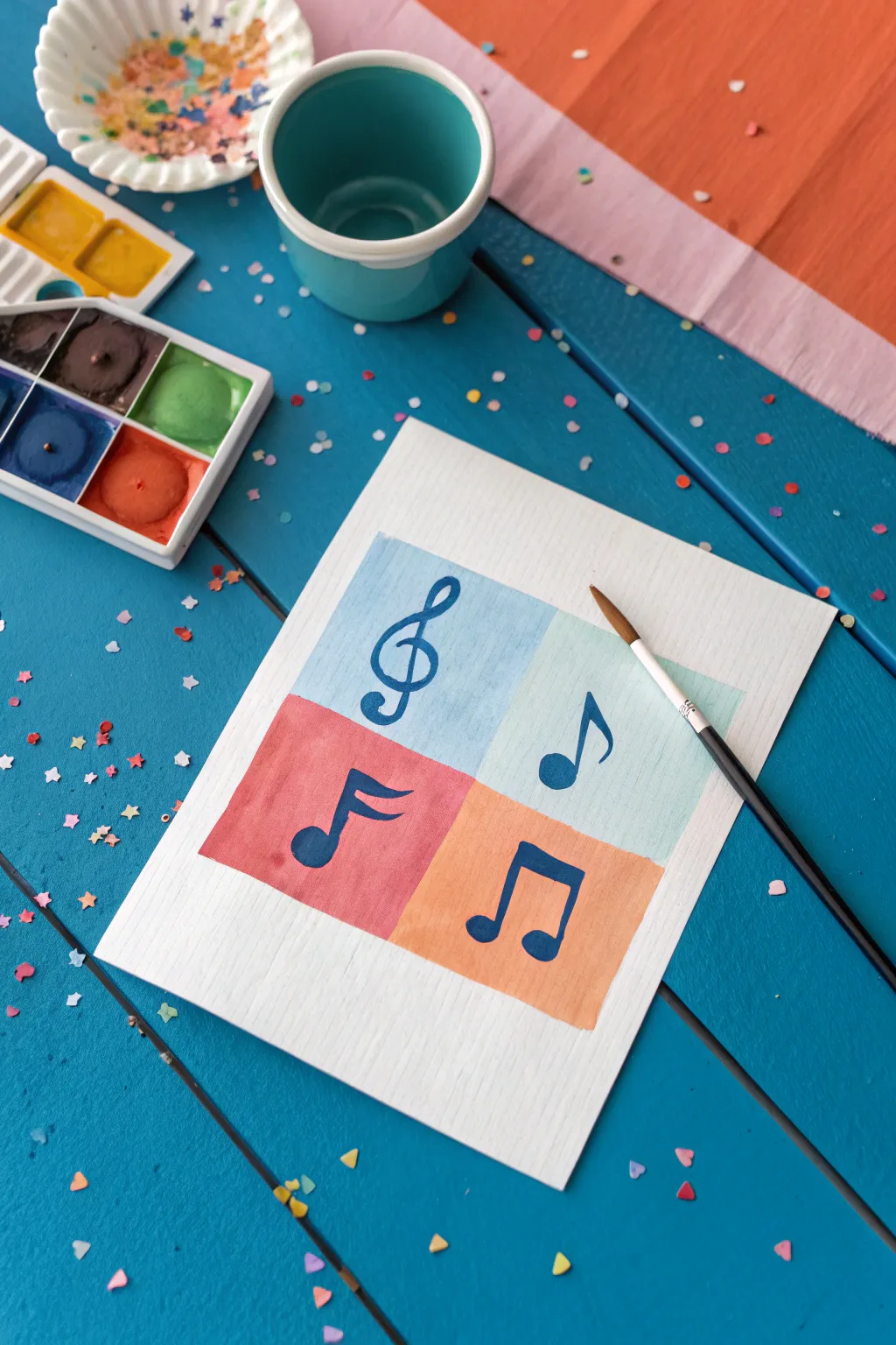 Confetti-style music notes over a vibrant acrylic wash for an easy, joyful background idea.