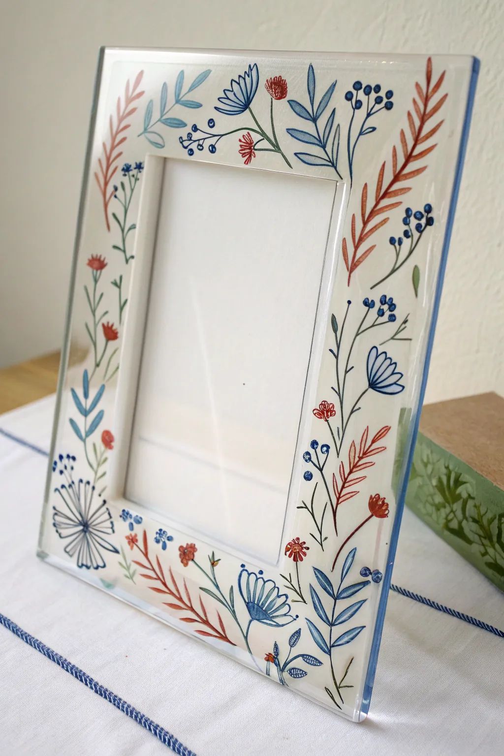Wildflower doodle border on glass for airy negative space and minimalist boho vibes.