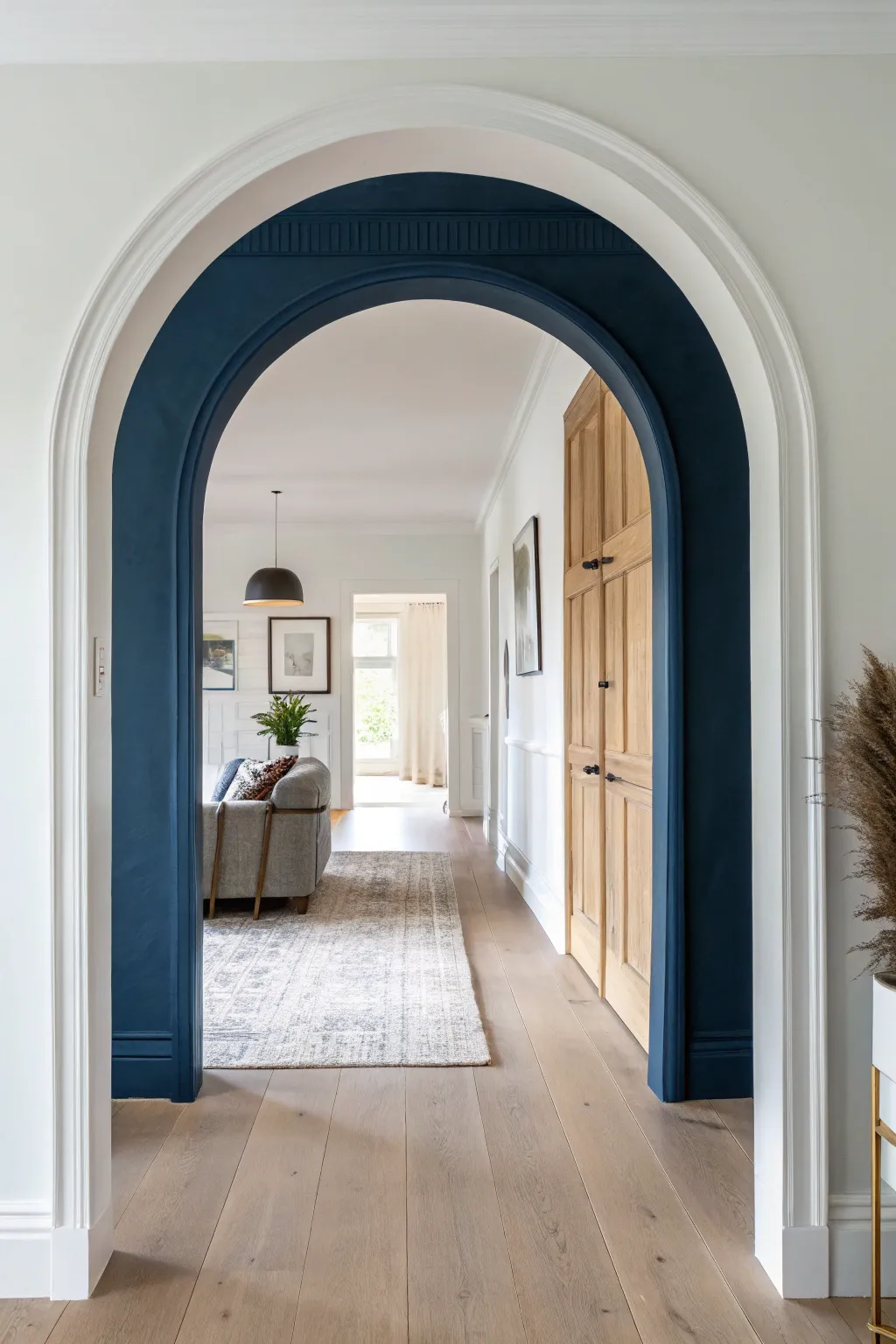 Bold full-color archway block paint that adds depth and a beautiful room-to-room transition