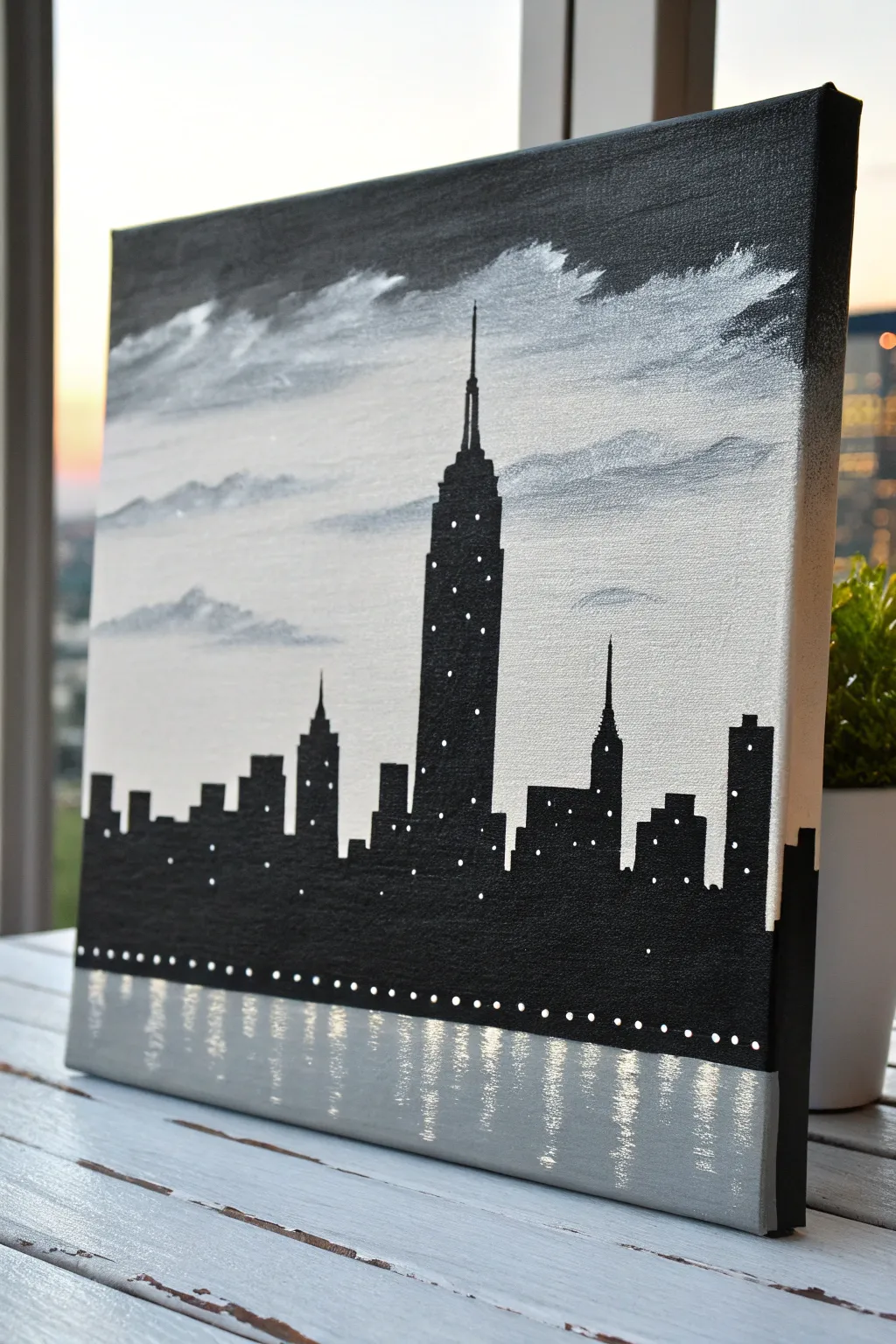 Bold black skyline on linen canvas, minimalist contrast with a soft reflected echo below.