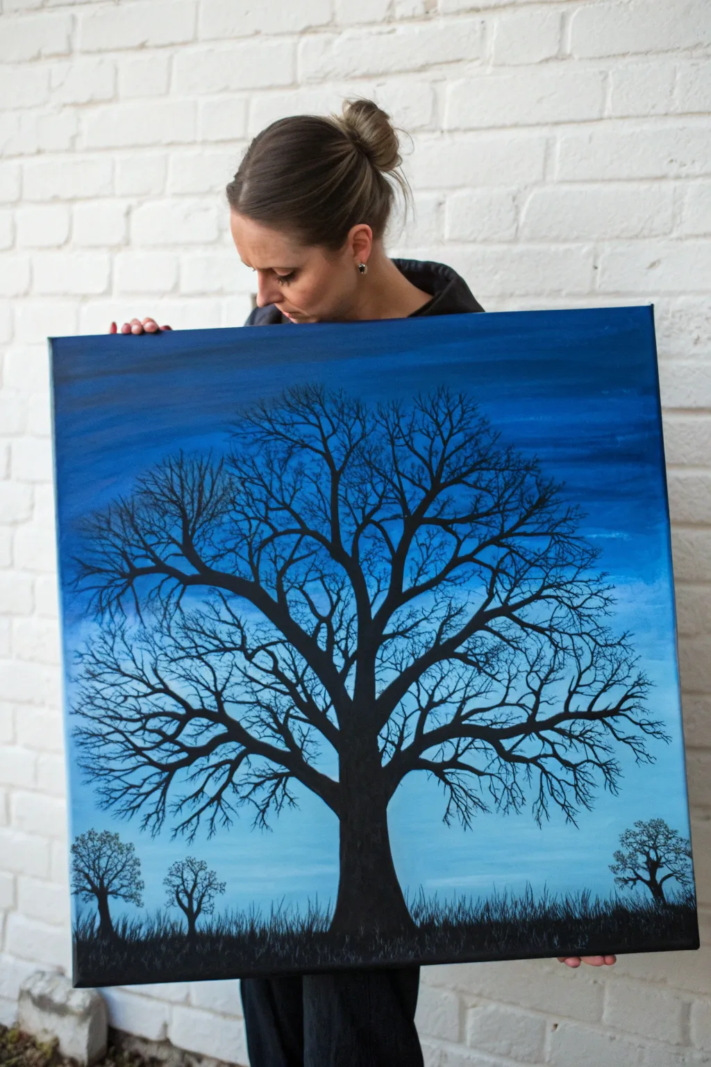 Twilight blue ombre with delicate black tree silhouettes for a bold, minimalist painting idea.