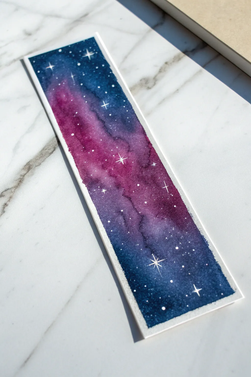 Create stunning starry skies by sprinkling coarse salt over wet watercolor for a magical galaxy effect.