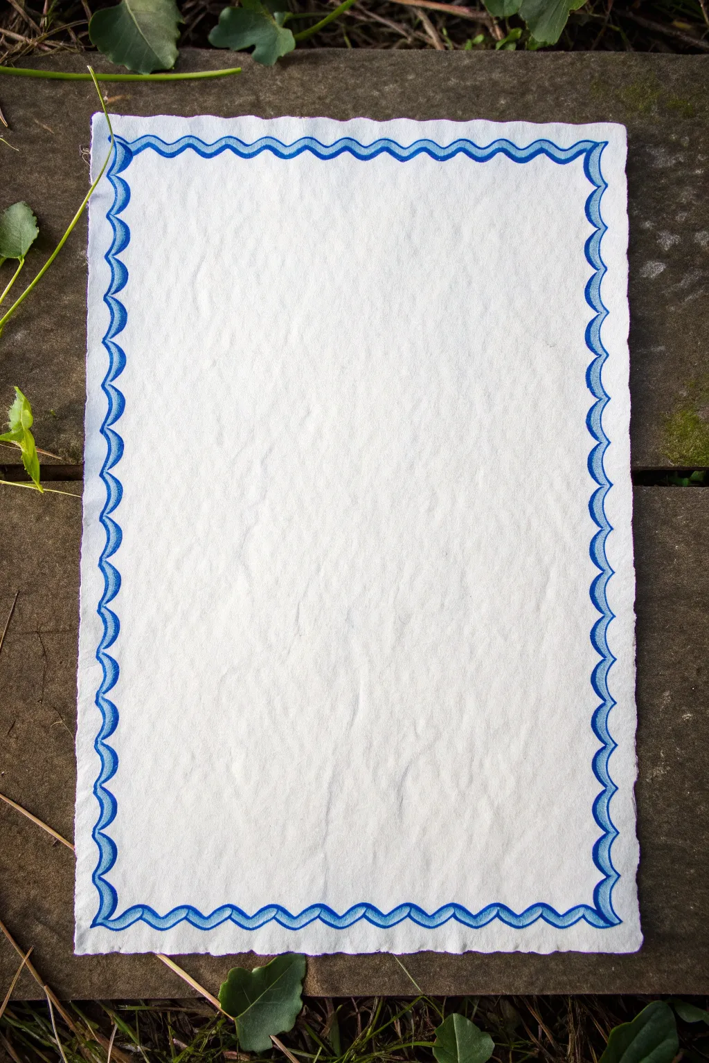 Playful wavy line border in bold blue, simple and loose, ready to frame any doodle.