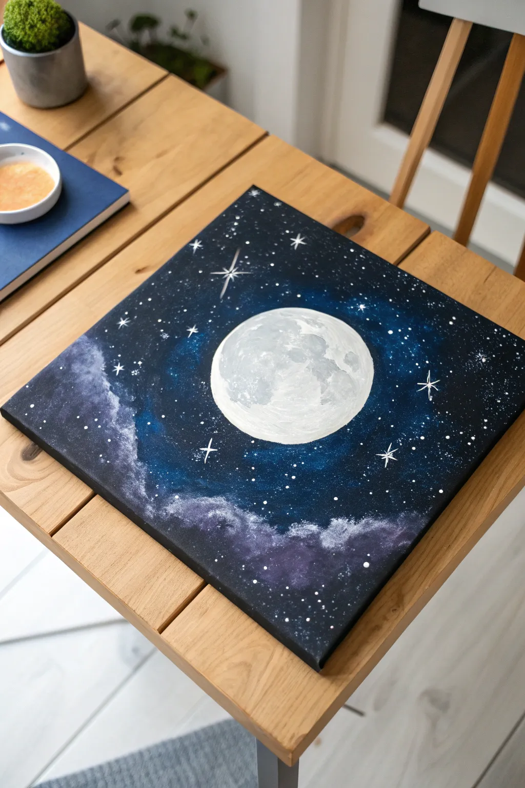 Bring the cosmos home with this dreamy DIY galaxy canvas art idea.