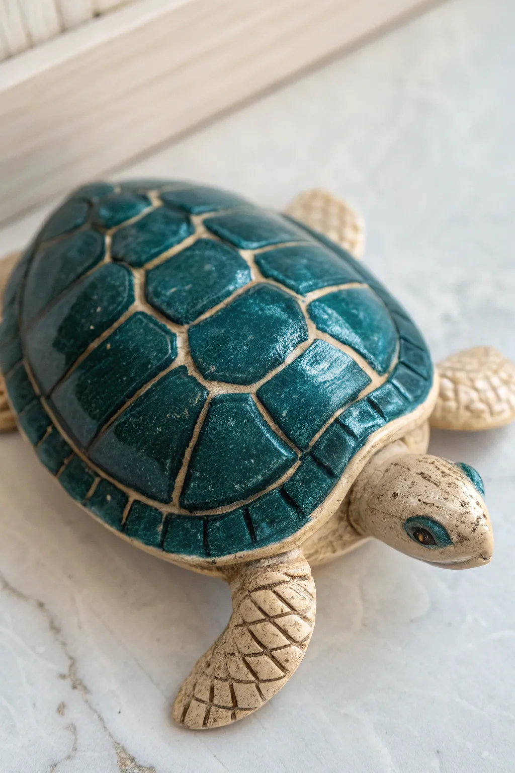 Dry-brushed shell edges make this ceramic turtle pop with sculpted texture and soft boho tones.